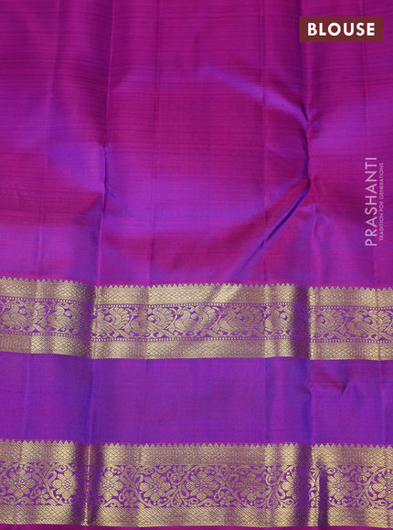 Pure kanchipuram silk saree dual shade of bluish green and purple with zari woven buttas and rettapet zari woven border