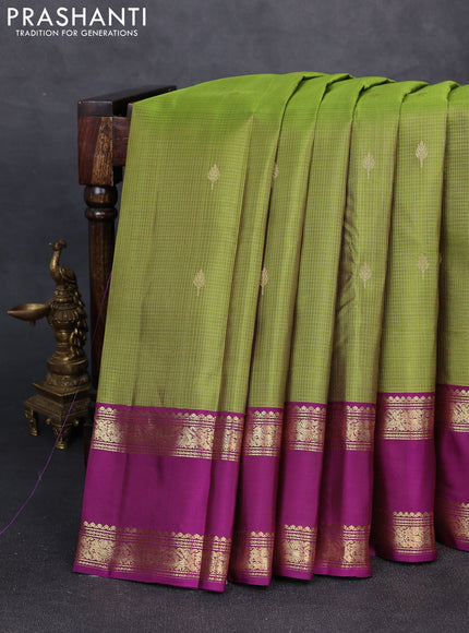 Pure kanchipuram silk saree mehendi green and purple with allover small zari checks & buttas and rettapet zari woven border