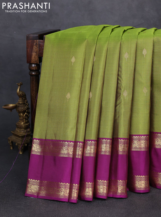 Pure kanchipuram silk saree mehendi green and purple with allover small zari checks & buttas and rettapet zari woven border