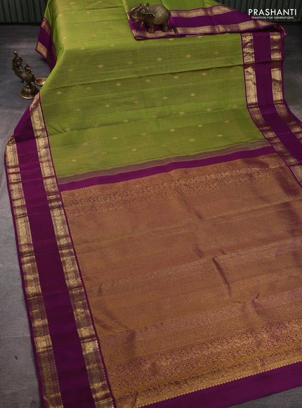 Pure kanchipuram silk saree mehendi green and purple with allover small zari checks & buttas and rettapet zari woven border