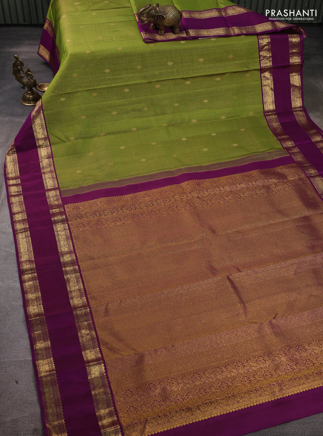 Pure kanchipuram silk saree mehendi green and purple with allover small zari checks & buttas and rettapet zari woven border