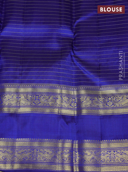 Pure kanchipuram silk saree purple and blue with allover small zari checks & buttas and long rettapet zari woven border