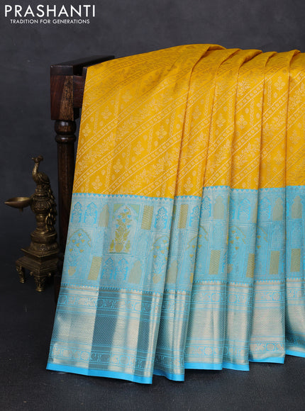 Pure kanchipuram silk saree yellow and teal blue with allover zari brocade weaves and long zari woven border