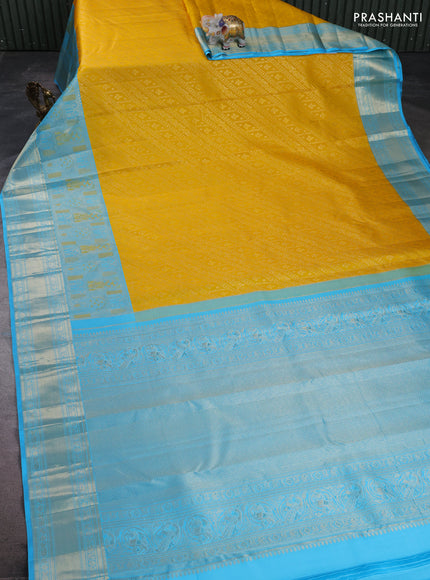 Pure kanchipuram silk saree yellow and teal blue with allover zari brocade weaves and long zari woven border