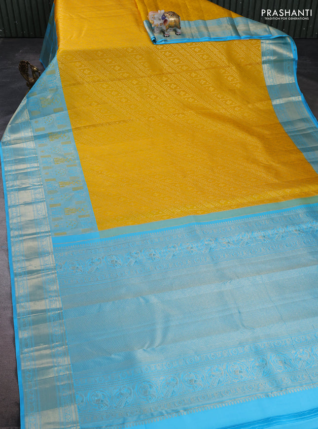 Pure kanchipuram silk saree yellow and teal blue with allover zari brocade weaves and long zari woven border