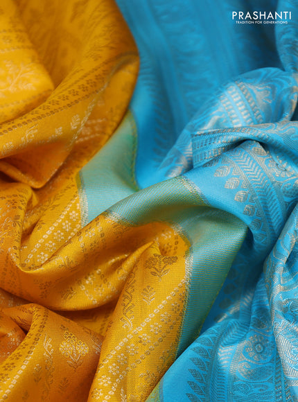 Pure kanchipuram silk saree yellow and teal blue with allover zari brocade weaves and long zari woven border