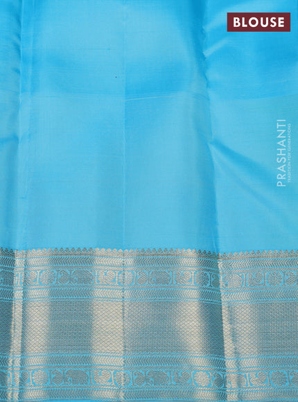 Pure kanchipuram silk saree yellow and teal blue with allover zari brocade weaves and long zari woven border