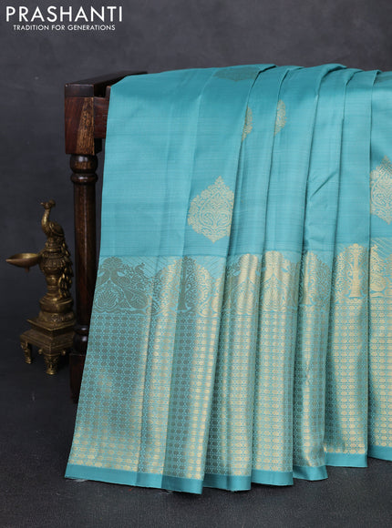 Pure kanchipuram silk saree teal shade with zari woven buttas and long zari woven border