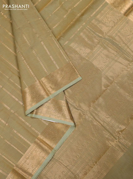Kanchi cotton saree elaichi green with allover zari weaves pattern and zari woven border