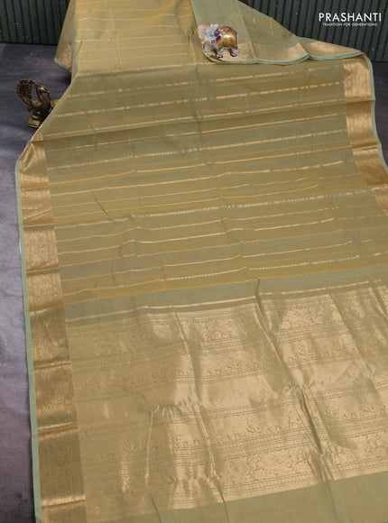 Kanchi cotton saree elaichi green with allover zari weaves pattern and zari woven border