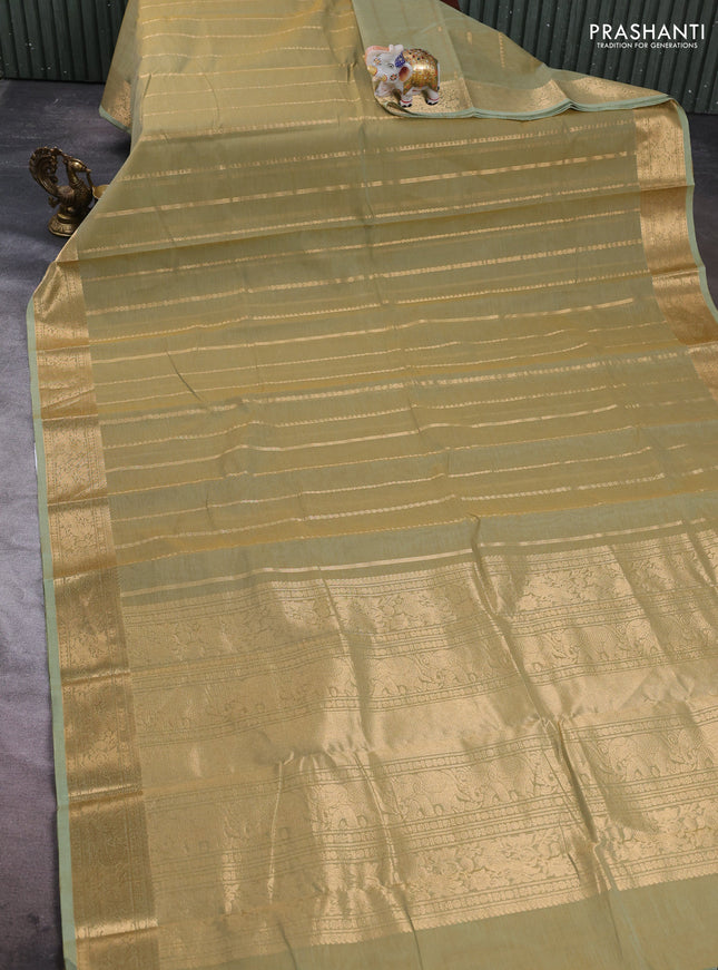 Kanchi cotton saree elaichi green with allover zari weaves pattern and zari woven border