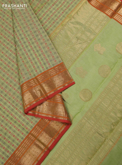 Kanchi cotton saree pista green and orange with allover zari woven checked pattern and zari woven border