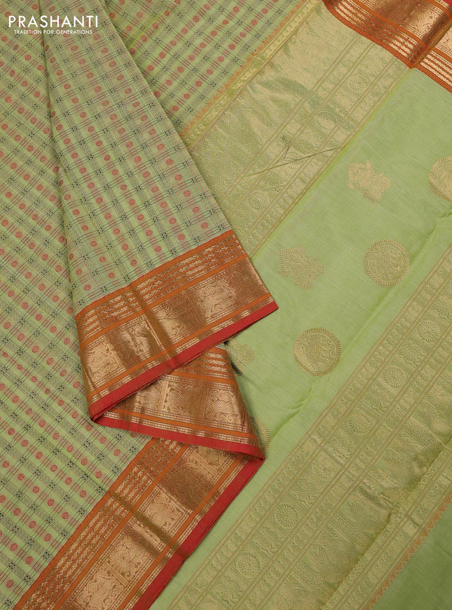 Kanchi cotton saree pista green and orange with allover zari woven checked pattern and zari woven border