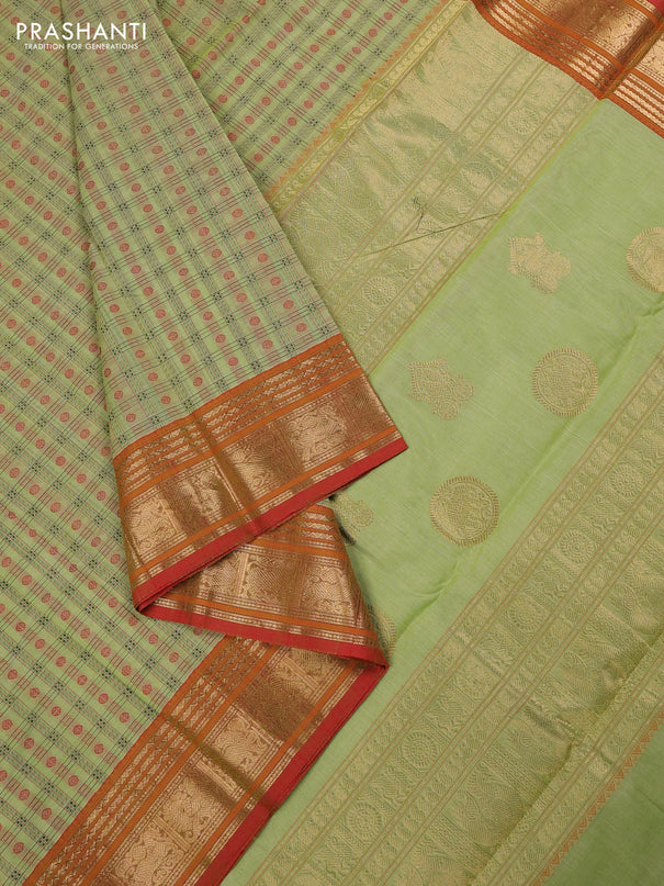 Kanchi cotton saree pista green and orange with allover zari woven checked pattern and zari woven border