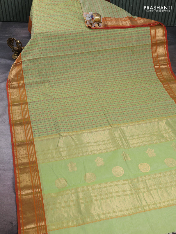 Kanchi cotton saree pista green and orange with allover zari woven checked pattern and zari woven border