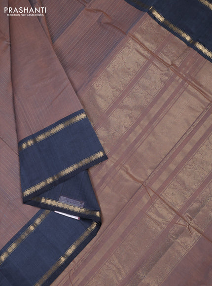 Kanchi cotton saree dual shade of rust and greyish blue with allover zari stripe pattern and rettapet zari woven border