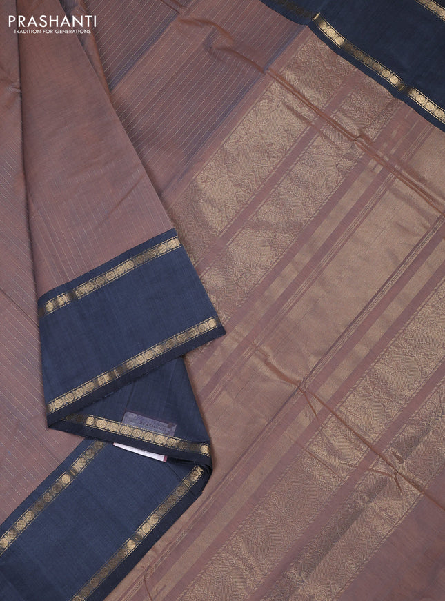 Kanchi cotton saree dual shade of rust and greyish blue with allover zari stripe pattern and rettapet zari woven border