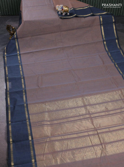 Kanchi cotton saree dual shade of rust and greyish blue with allover zari stripe pattern and rettapet zari woven border