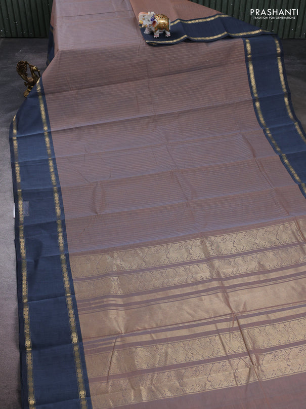Kanchi cotton saree dual shade of rust and greyish blue with allover zari stripe pattern and rettapet zari woven border