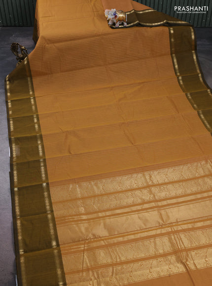 Kanchi cotton saree sandal and dark mustard with allover zari stripe pattern and rettapet zari woven border