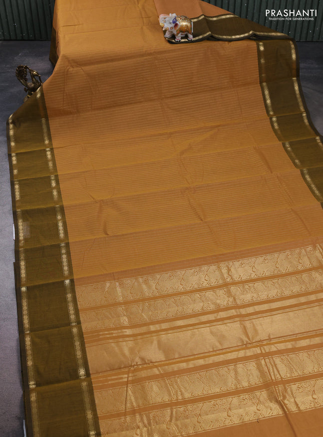 Kanchi cotton saree sandal and dark mustard with allover zari stripe pattern and rettapet zari woven border