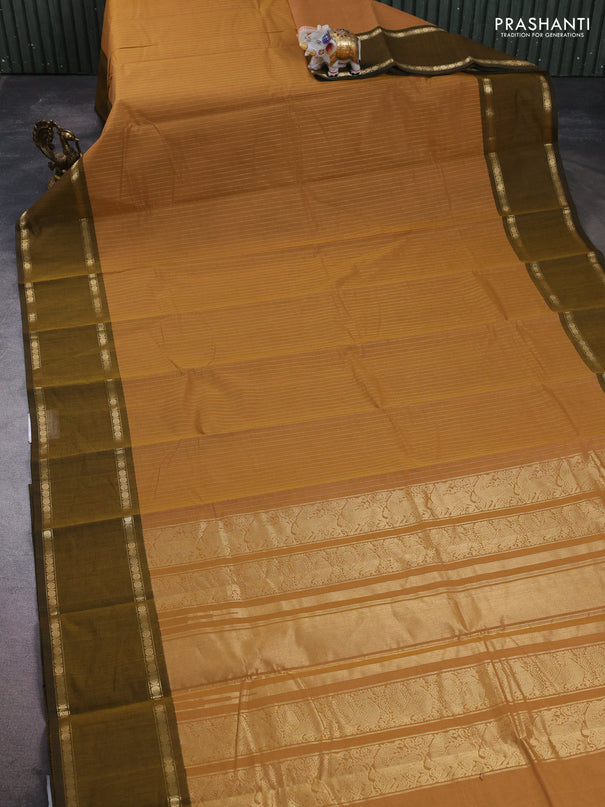 Kanchi cotton saree sandal and dark mustard with allover zari stripe pattern and rettapet zari woven border