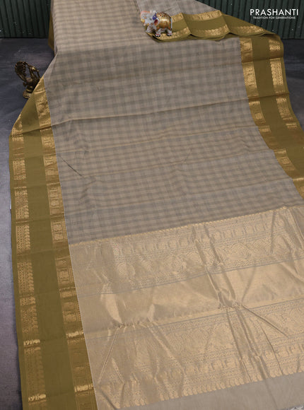 Kanchi cotton saree beige and mehendi green with allover thread woven checked pattern and rettapet zari woven border