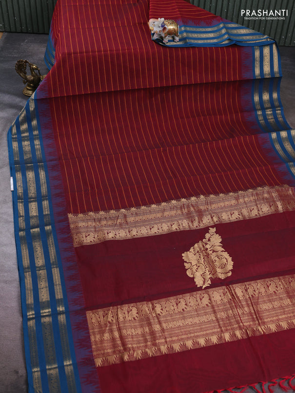 Kanchi cotton saree maroon and peacock blue with allover thread weaves and temple design zari woven border