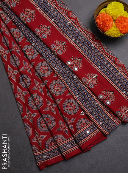 Muslin silk saree red shade with allover ajrakh butta prints and sequin mirror work embroidery pallu