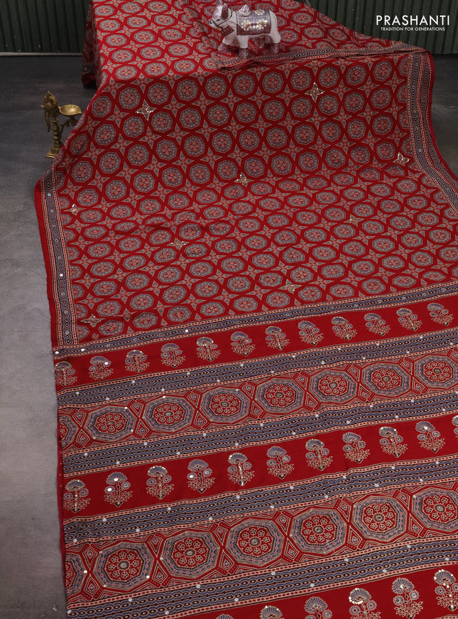 Muslin silk saree red shade with allover ajrakh butta prints and sequin mirror work embroidery pallu