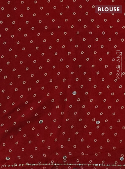 Muslin silk saree red shade with allover ajrakh butta prints and sequin mirror work embroidery pallu