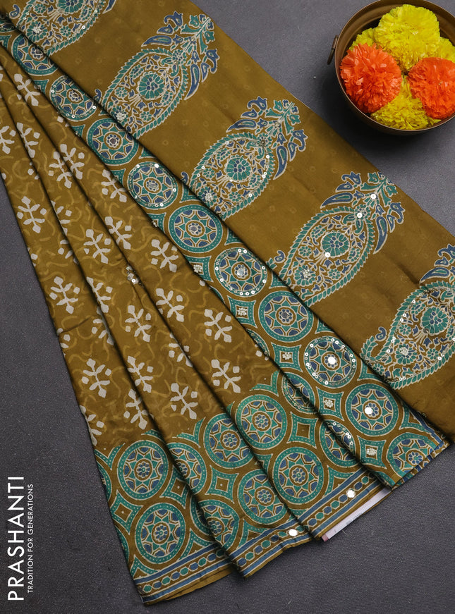 Muslin silk saree mehendi green with allover dabu butta prints and sequin mirror work embroidery pallu