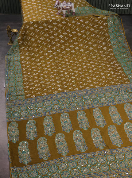 Muslin silk saree mehendi green with allover dabu butta prints and sequin mirror work embroidery pallu