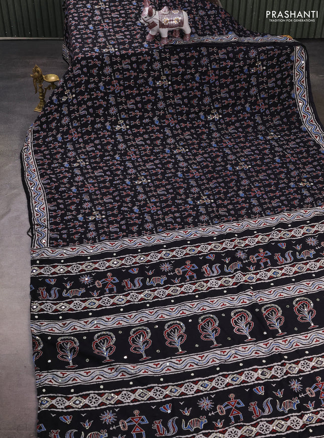 Muslin silk saree black with allover warli prints and sequin mirror work embroidery pallu