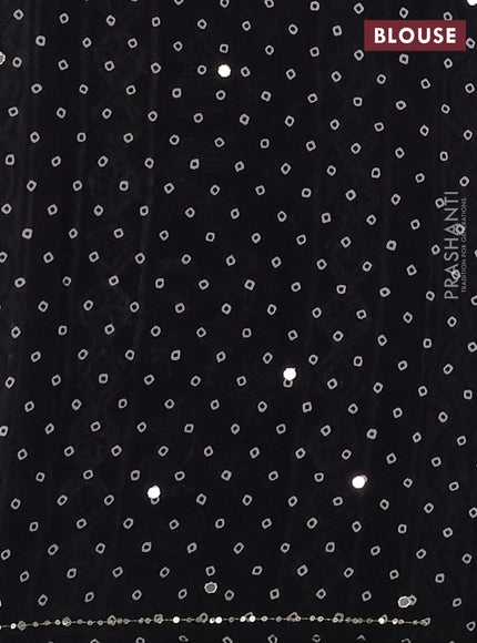 Muslin silk saree black with allover warli prints and sequin mirror work embroidery pallu