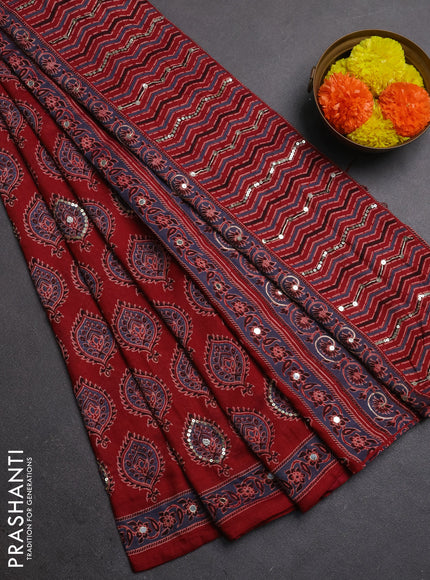 Muslin silk saree maroon with allover ajrakh butta prints and sequin mirror work embroidery pallu