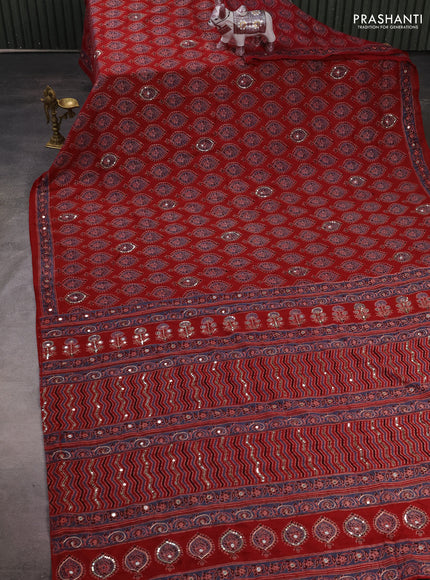 Muslin silk saree maroon with allover ajrakh butta prints and sequin mirror work embroidery pallu