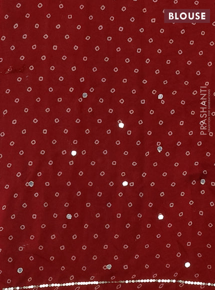 Muslin silk saree maroon with allover ajrakh butta prints and sequin mirror work embroidery pallu