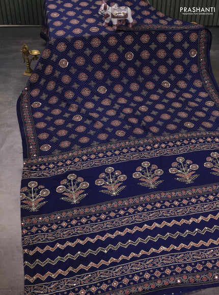 Muslin silk saree indigo blue with allover ajrakh butta prints and sequin mirror work embroidery pallu