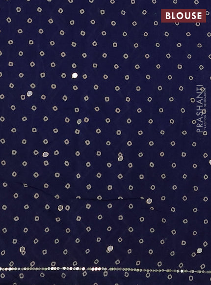 Muslin silk saree indigo blue with allover ajrakh butta prints and sequin mirror work embroidery pallu