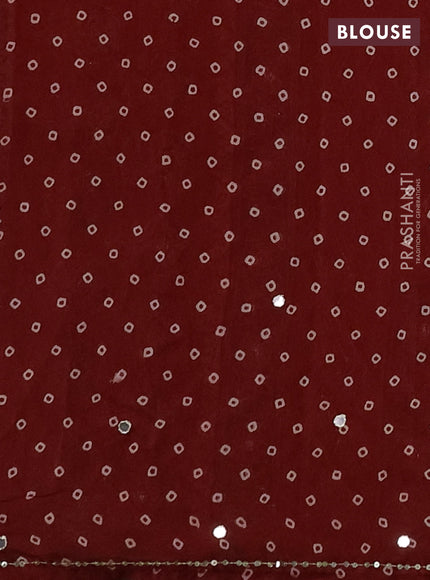 Muslin silk saree red shade with allover ajrakh butta prints and sequin mirror work embroidery pallu