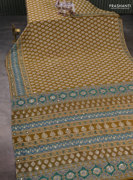 Muslin silk saree mehendi green with allover butta prints and sequin mirror work embroidery pallu