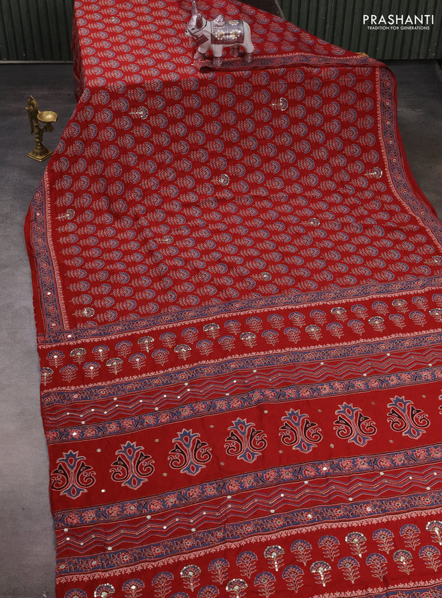 Muslin silk saree red shade with allover floral butta prints and sequin mirror work embroidery pallu