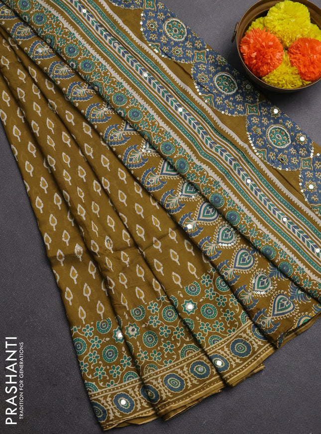 Muslin silk saree mehendi green with allover butta prints and sequin mirror work embroidery pallu