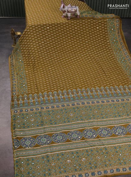 Muslin silk saree mehendi green with allover butta prints and sequin mirror work embroidery pallu