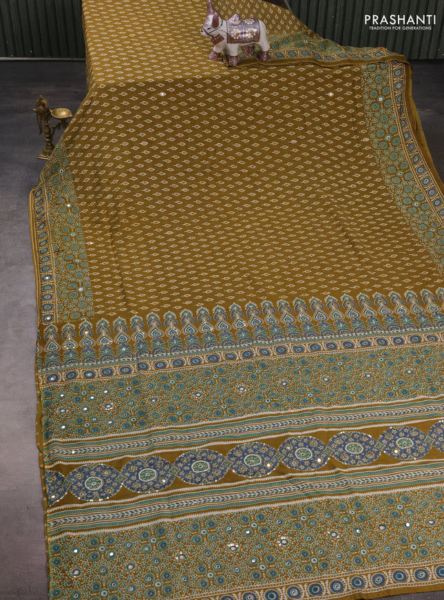 Muslin silk saree mehendi green with allover butta prints and sequin mirror work embroidery pallu