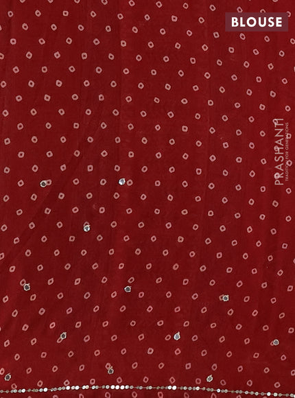 Muslin silk saree maroon with allover butta prints and sequin mirror work embroidery pallu