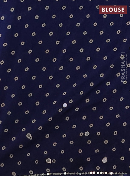Muslin silk saree indigo blue with allover ajrakh butta prints and sequin mirror work embroidery pallu