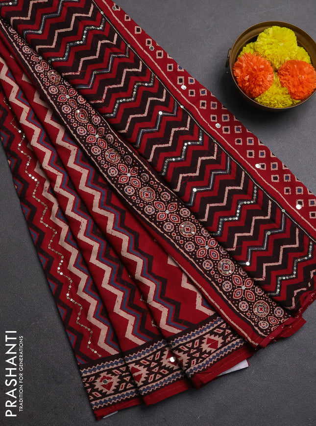 Muslin silk saree red shade with allover zigzag prints and sequin mirror work embroidery pallu
