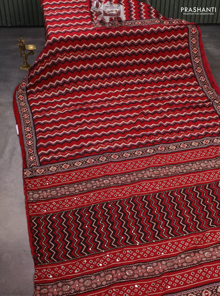 Muslin silk saree red shade with allover zigzag prints and sequin mirror work embroidery pallu